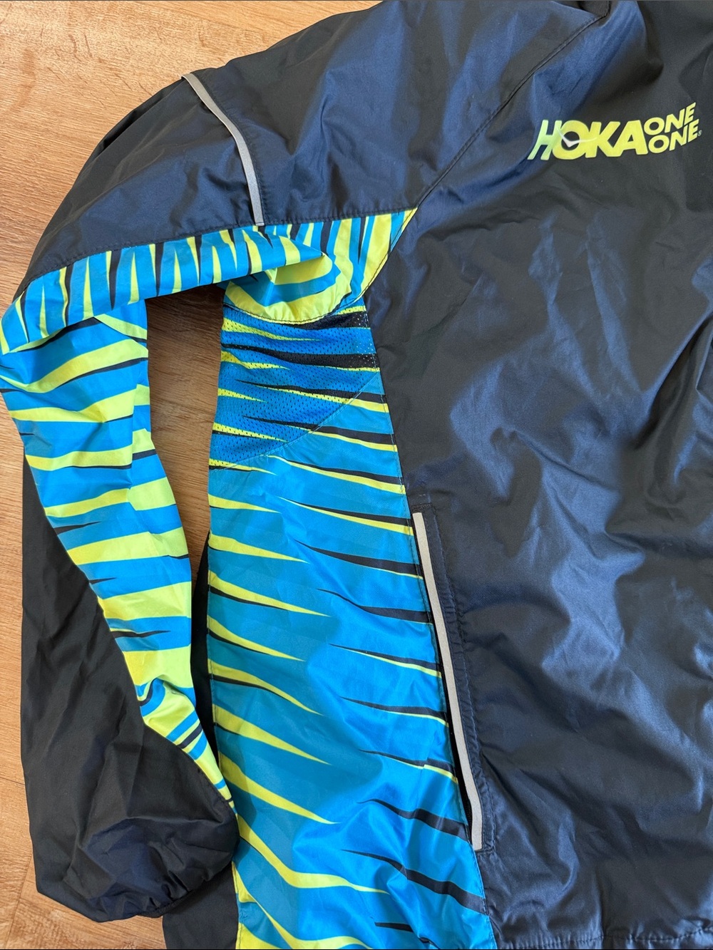 Hoka One One Women’s Black Jacket with Blue & Yellow Striped Top - Picture 4 of 5